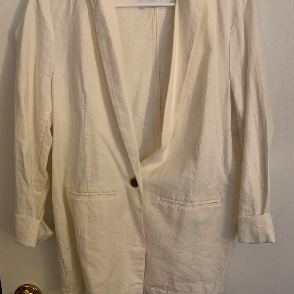 Cream colored blazer.